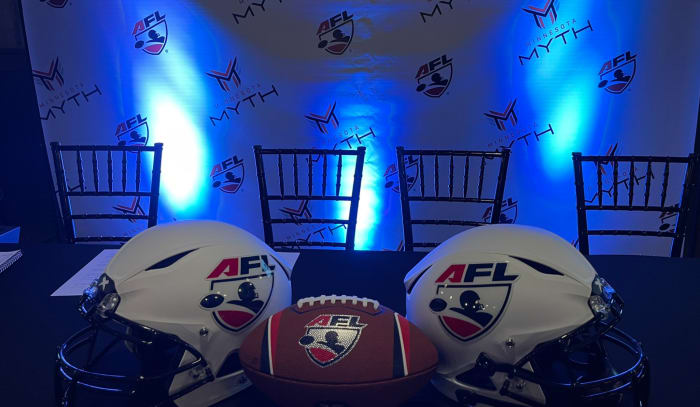 A view of the AFL helmets and football with the Minnesota Myth logos in the background.